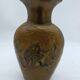 Enamelled brass vase decorated with owls.