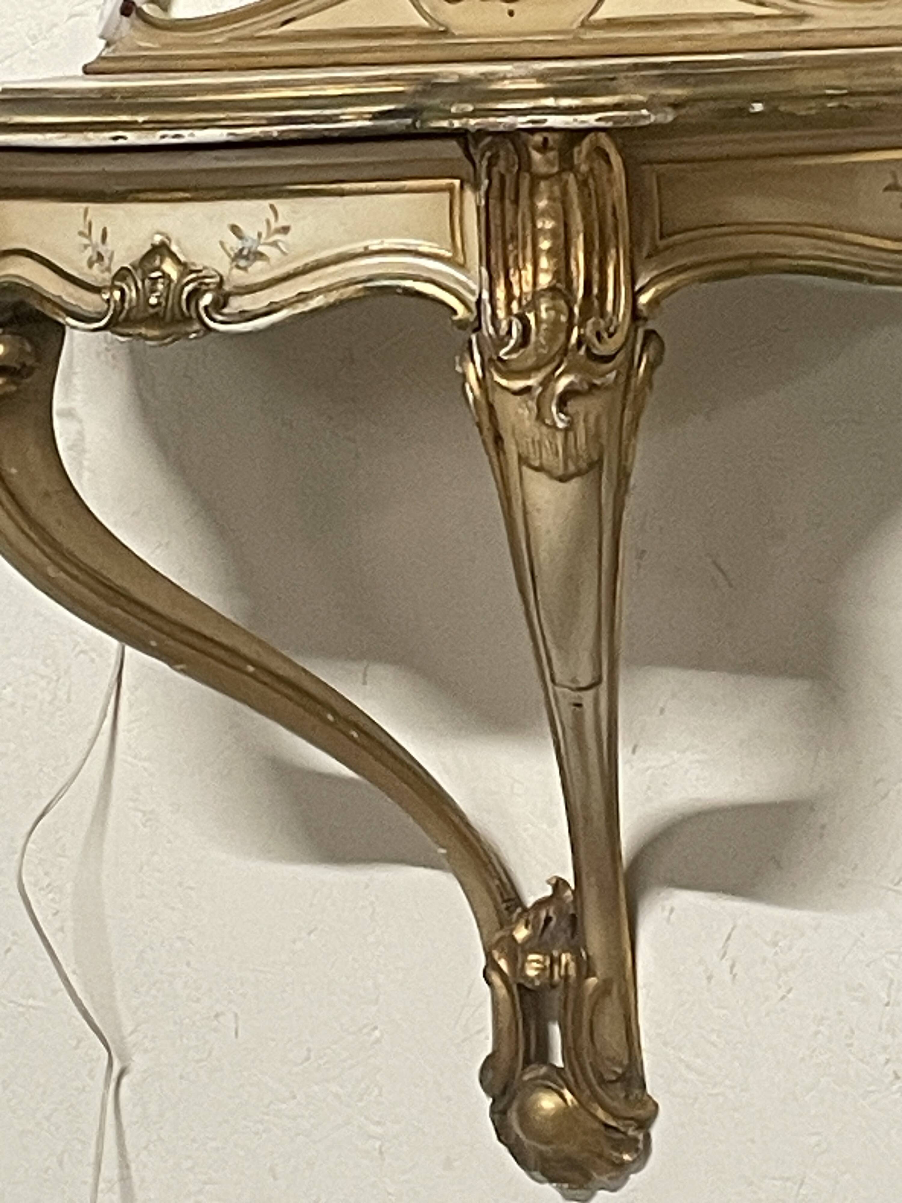Pair of wall-mounted consoles with a mirror in Louis XV style.