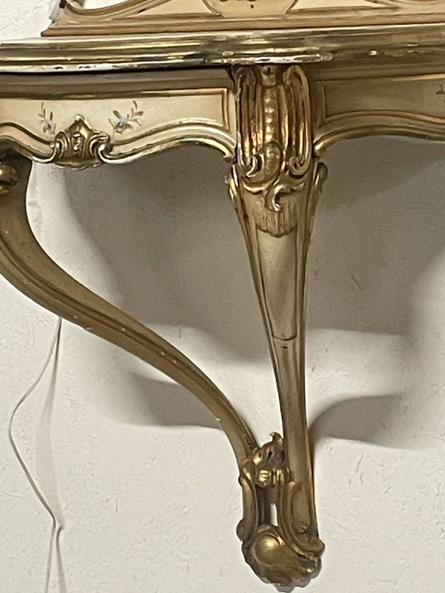 Pair of wall-mounted consoles with a mirror in Louis XV style.