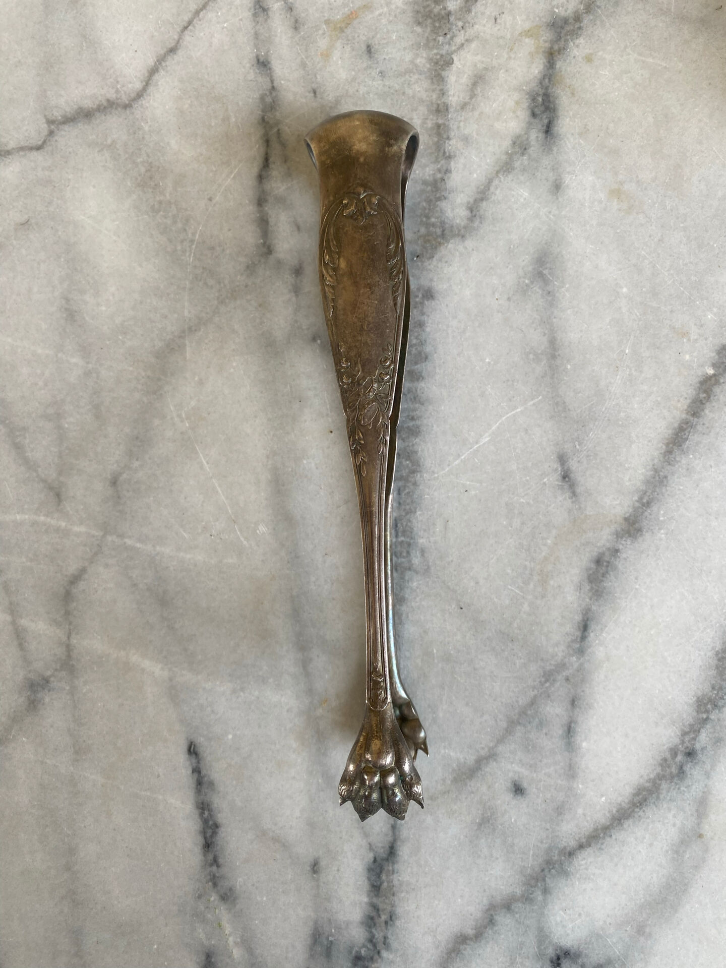 Antique silver-plated sugar tongs SFAM with monogram.