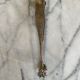 Antique silver-plated sugar tongs SFAM with monogram.