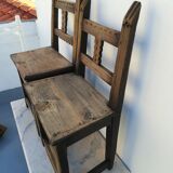 Pair of ethnic crude wooden chairs