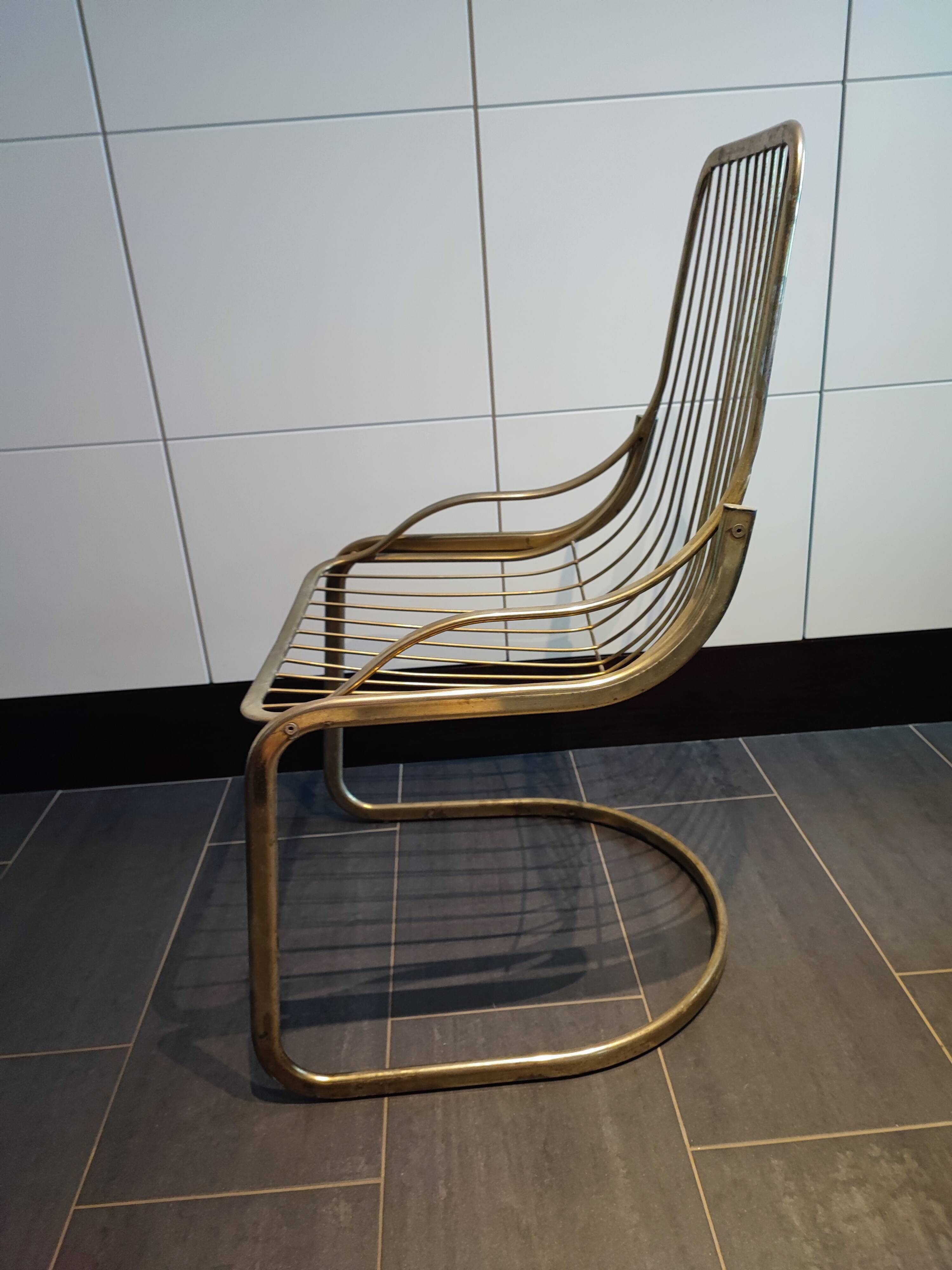 Tubular metal chair covered with gilding