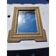 Wood and gilded stucco mirror