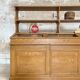 Wooden hardware cabinet painted with wood effect, circa 1940.