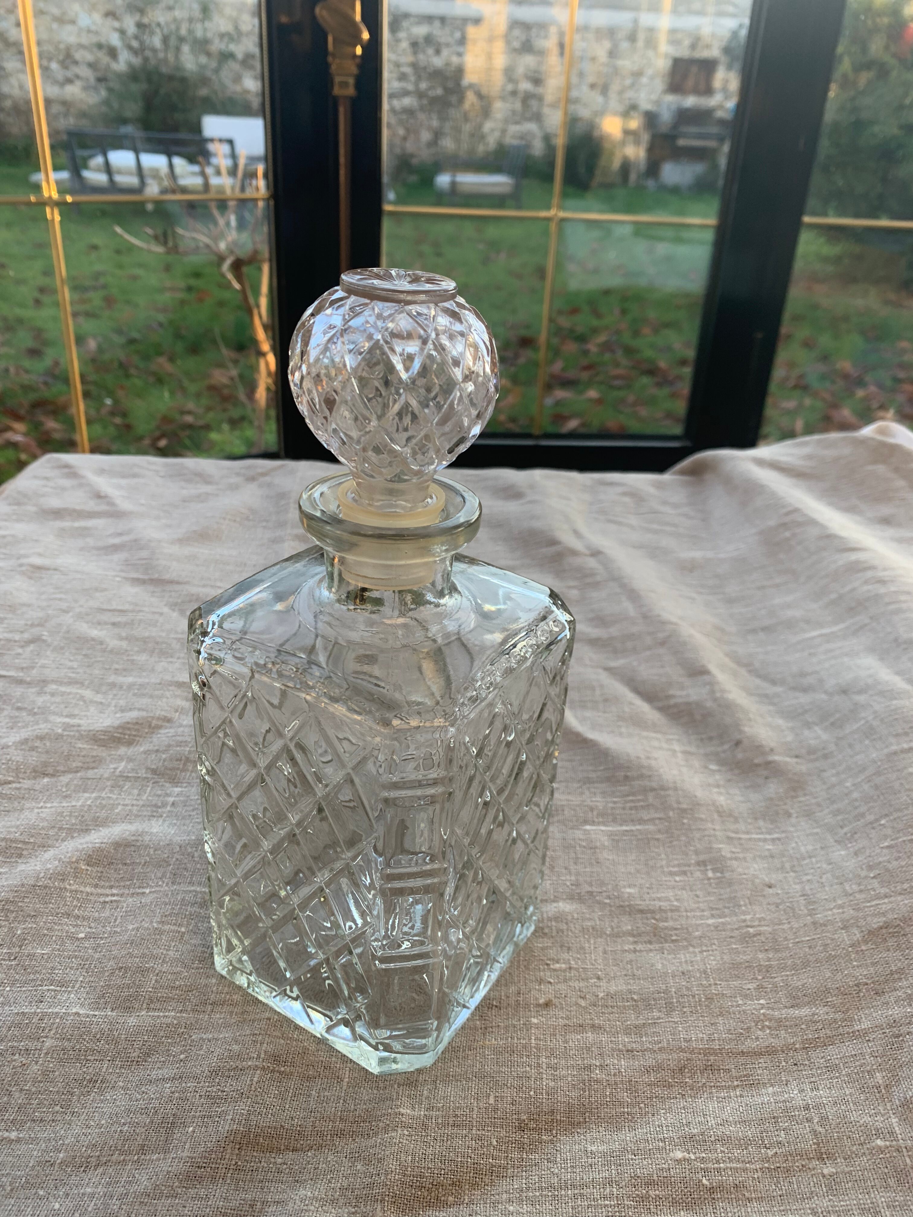 Vintage transparent molded glass whisky decanter