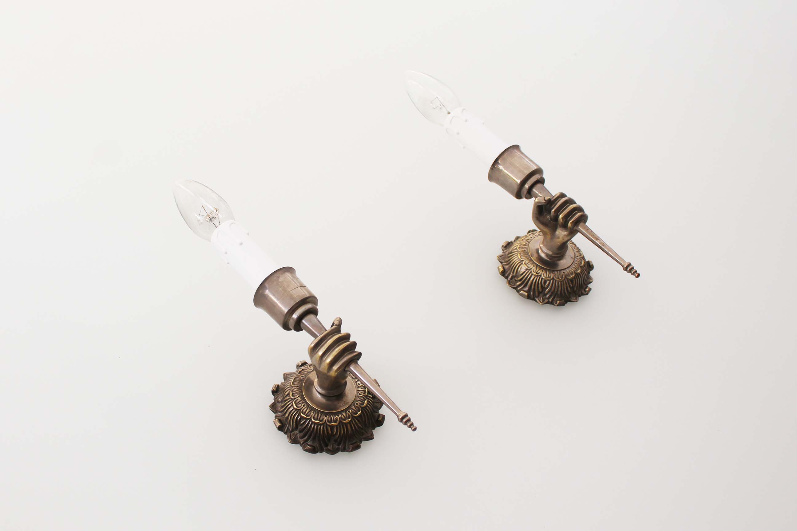 Pair of 1950’s solid metal ‘torch holding hand’ wall sconces by maison arlus