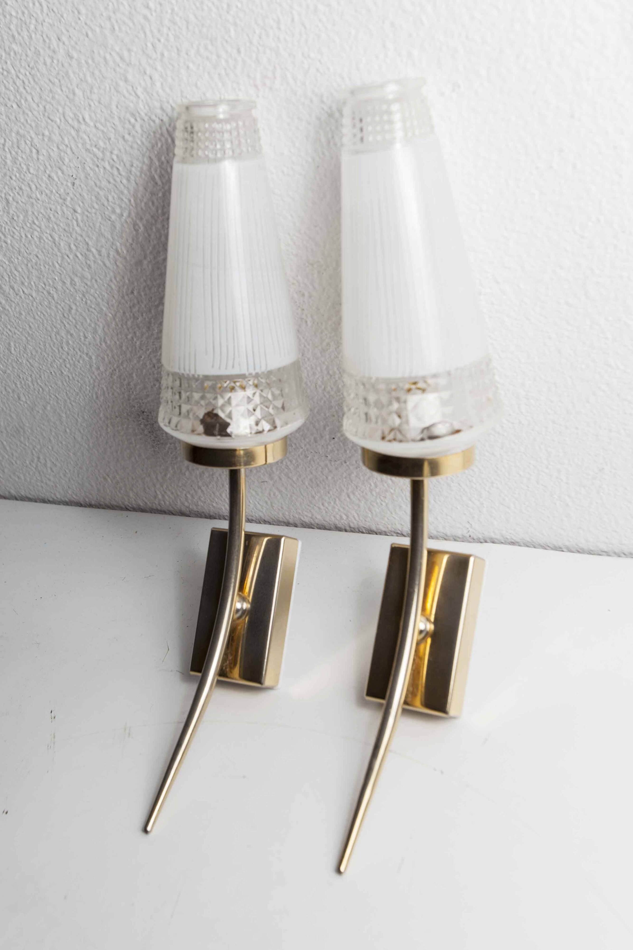 Pair of brass and white and transparent glass wall lights 1960