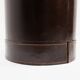 Brown leather wastepaper basket with decorative gold metal buckle.