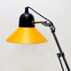Aluminor desk lamp,vintage 70s, in orange-yellow and black lacquered metal. Good condition.