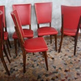Lot of 8 vintage wooden chairs and red skai