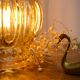 Vintage amber glass globe hand lamp