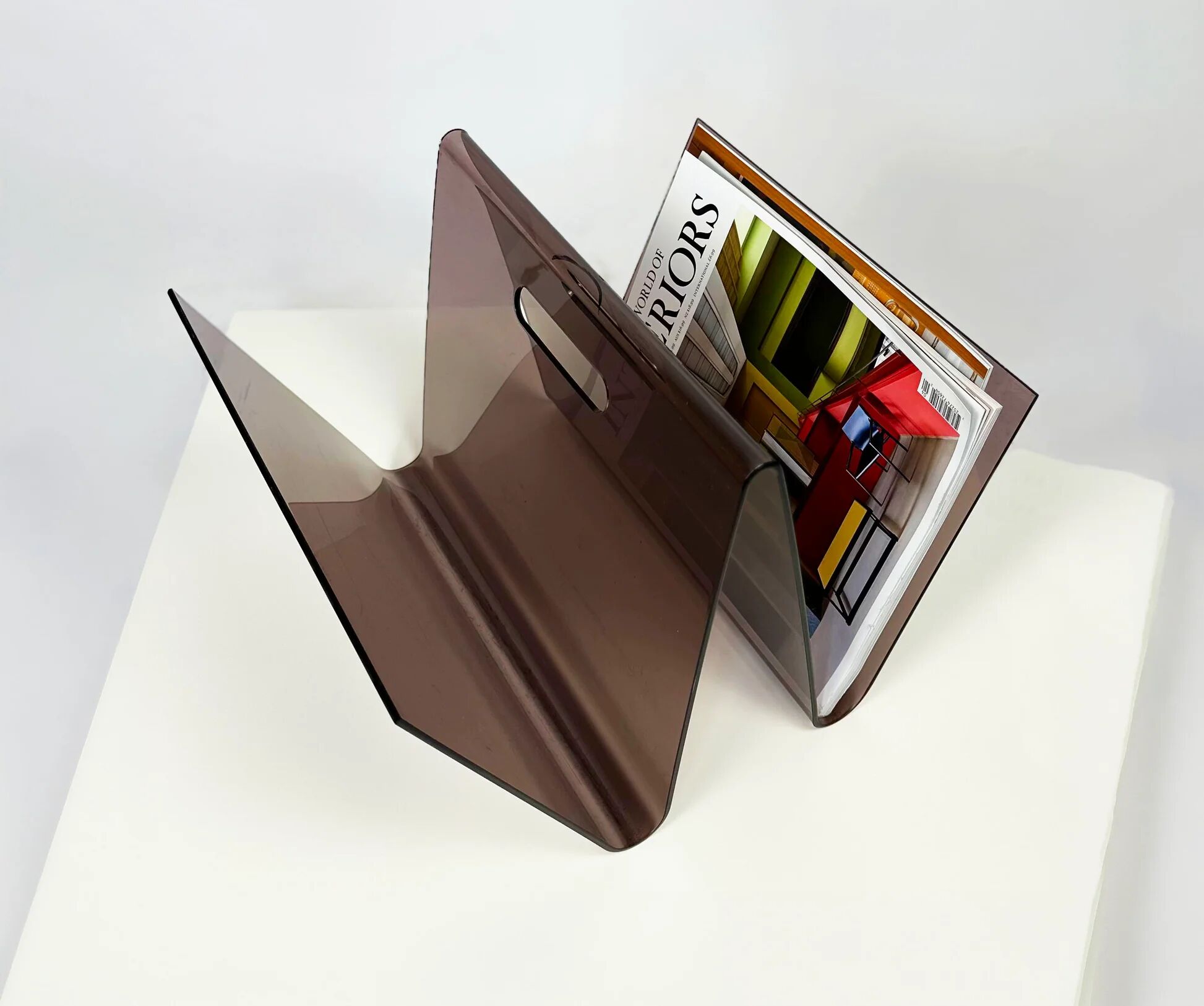 Smoked plexiglass magazine rack in the shape of a W — 1970s