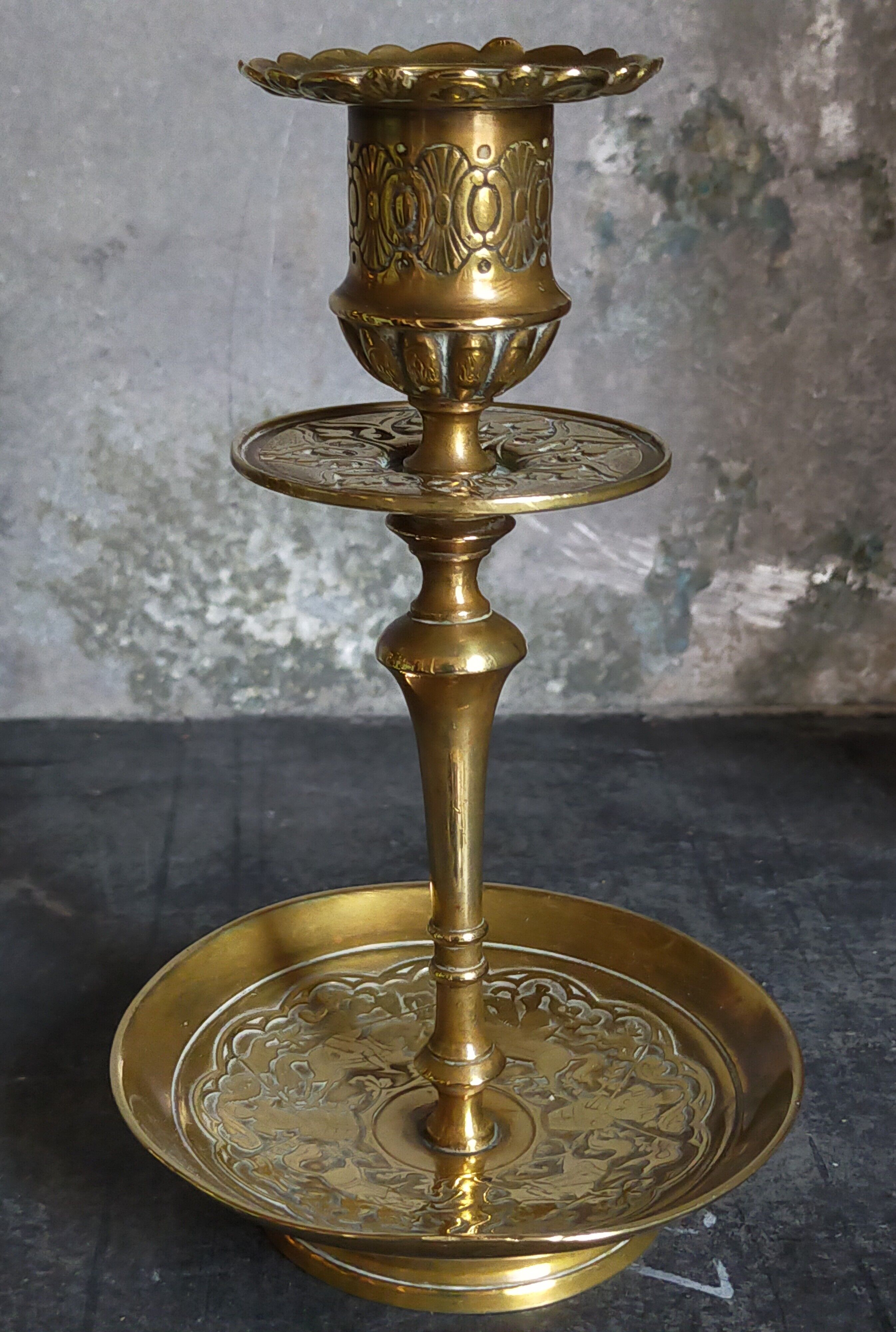 Duo of solid brass and gold metal candle holders worked old
