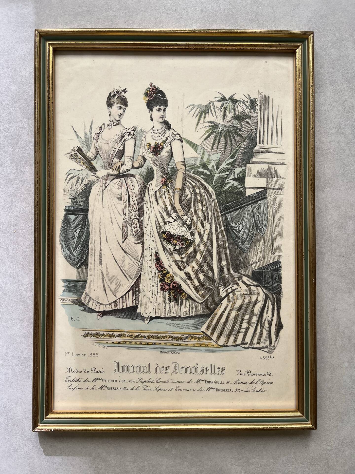 Pair of framed fashion engravings from the 19th century.