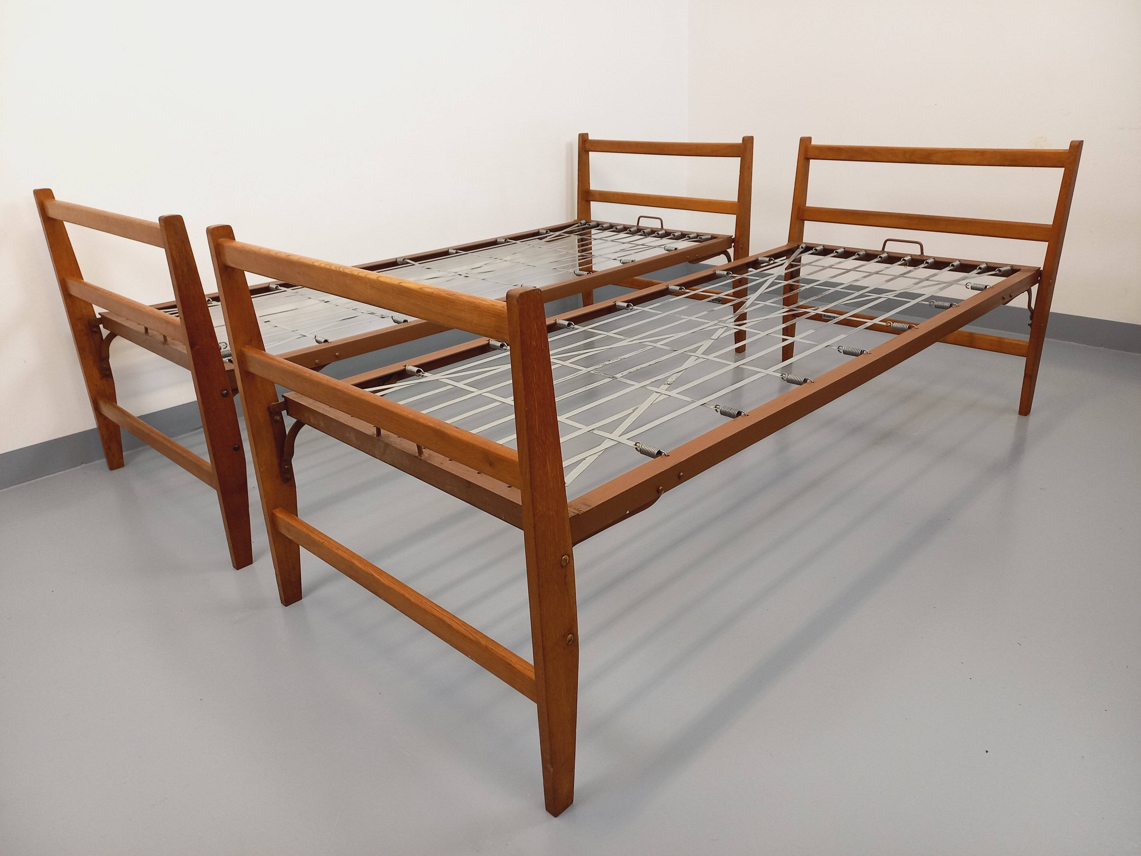 Pair of vintage stackable daybeds in oak wood and metal from the 60s