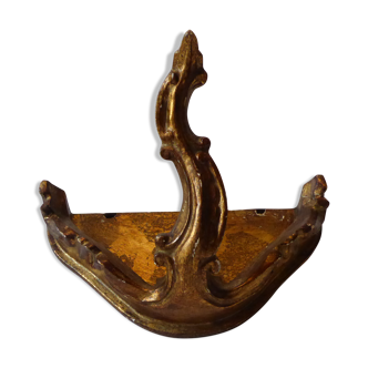 Ancient decorative applique in carved and gilded wood
