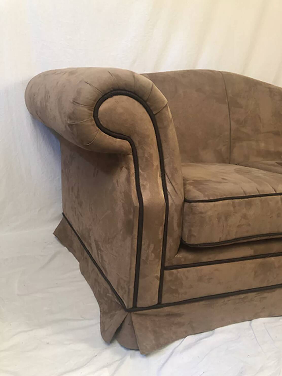 Pair of two-seater sofas with wide armrests