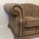 Pair of two-seater sofas with wide armrests
