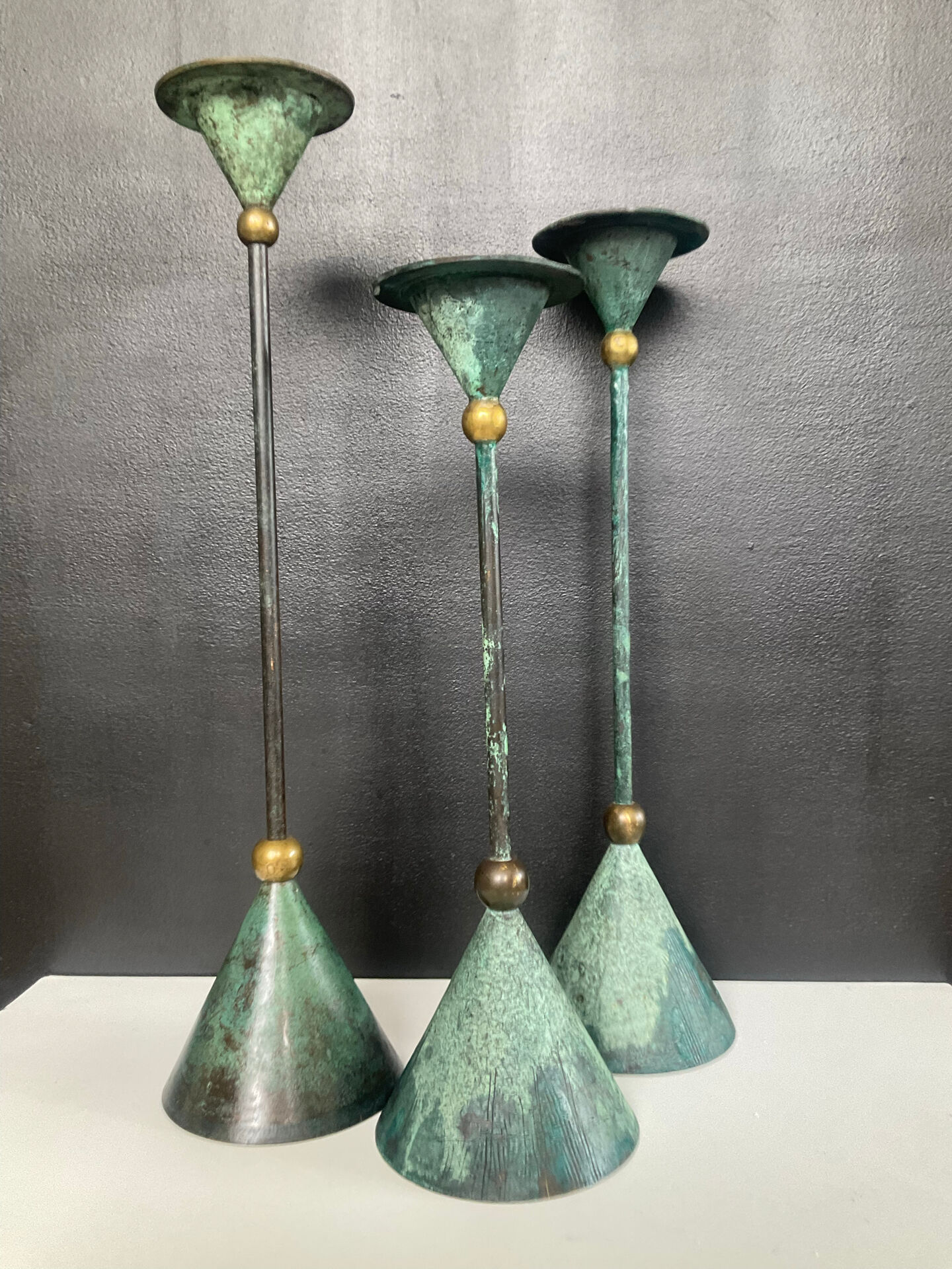 Postmodern metal candlestick trio