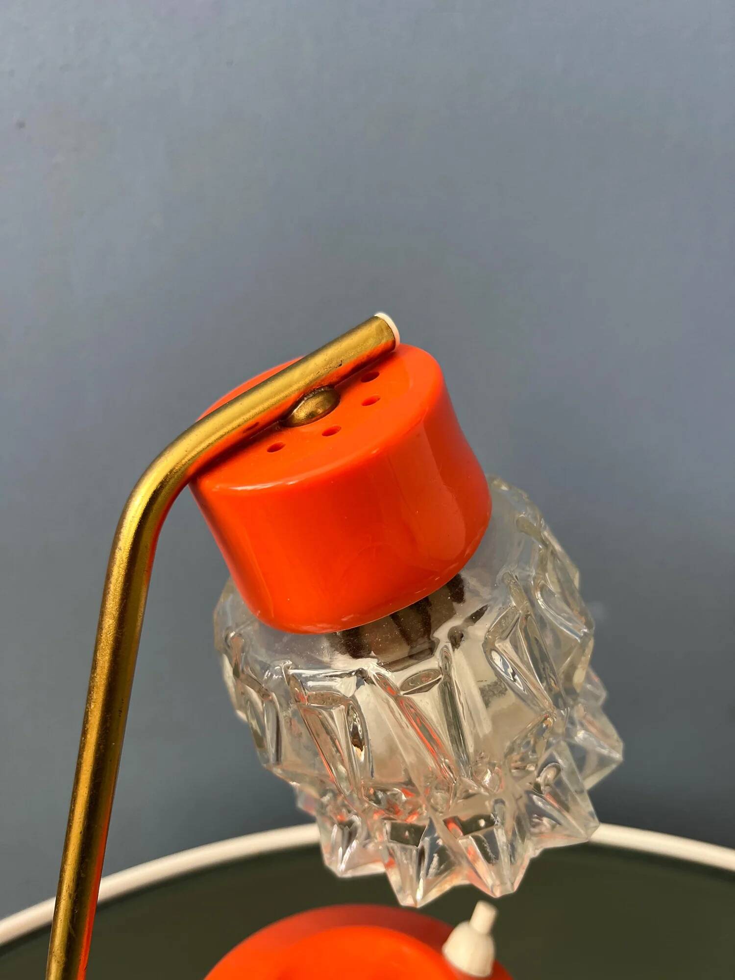Small orange desk lamp with clear crystal glass shade