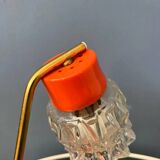 Small orange desk lamp with clear crystal glass shade