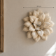Flower applique attributed to Masca, 52cm in diameter.