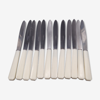 12 knives with a white plastic handle - circa 1970