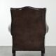 Dark brown cowhide Chesterfield wingback armchair in classic English style