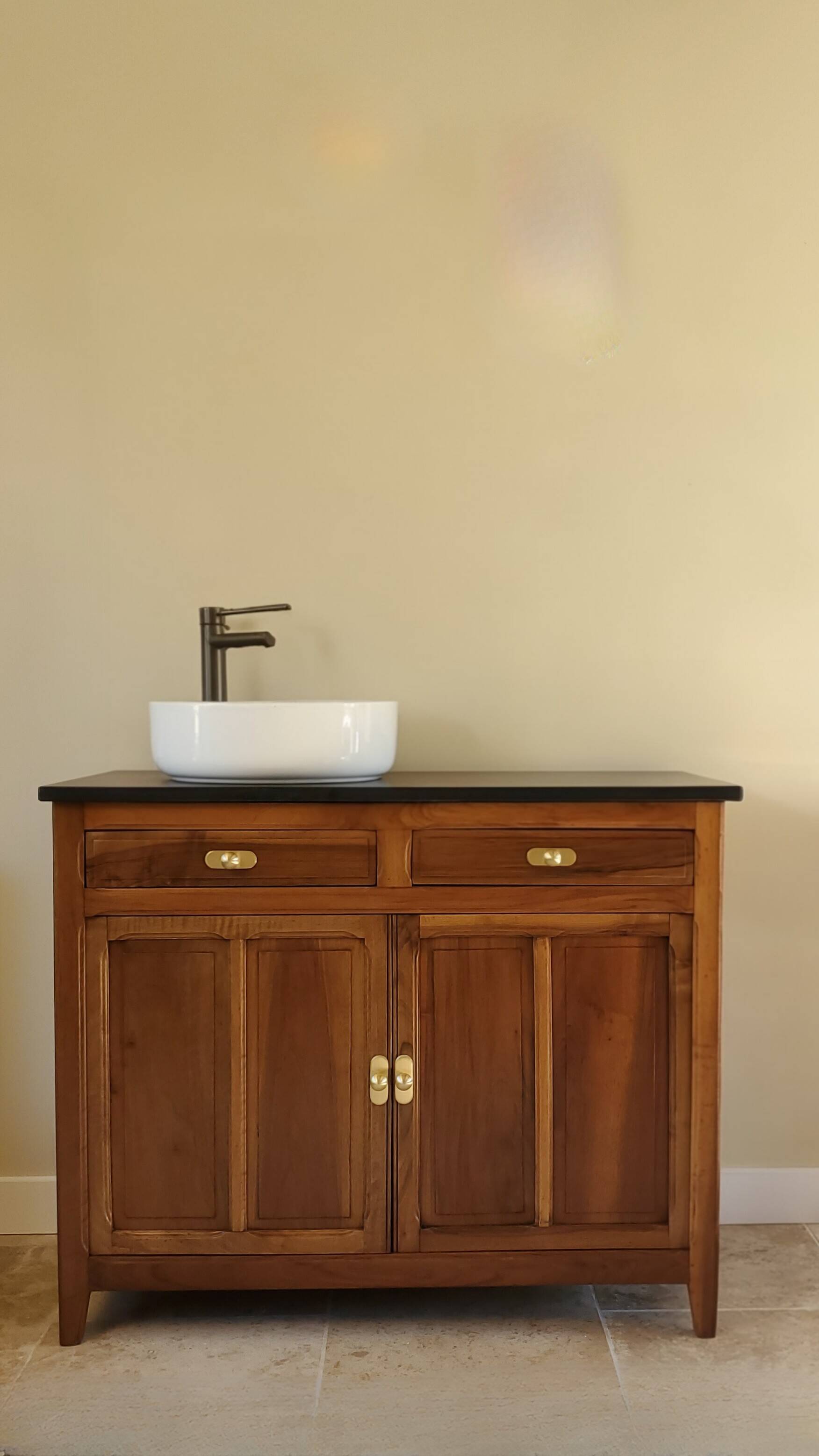 Vanity unit in solid walnut and Zimbabwean granite.