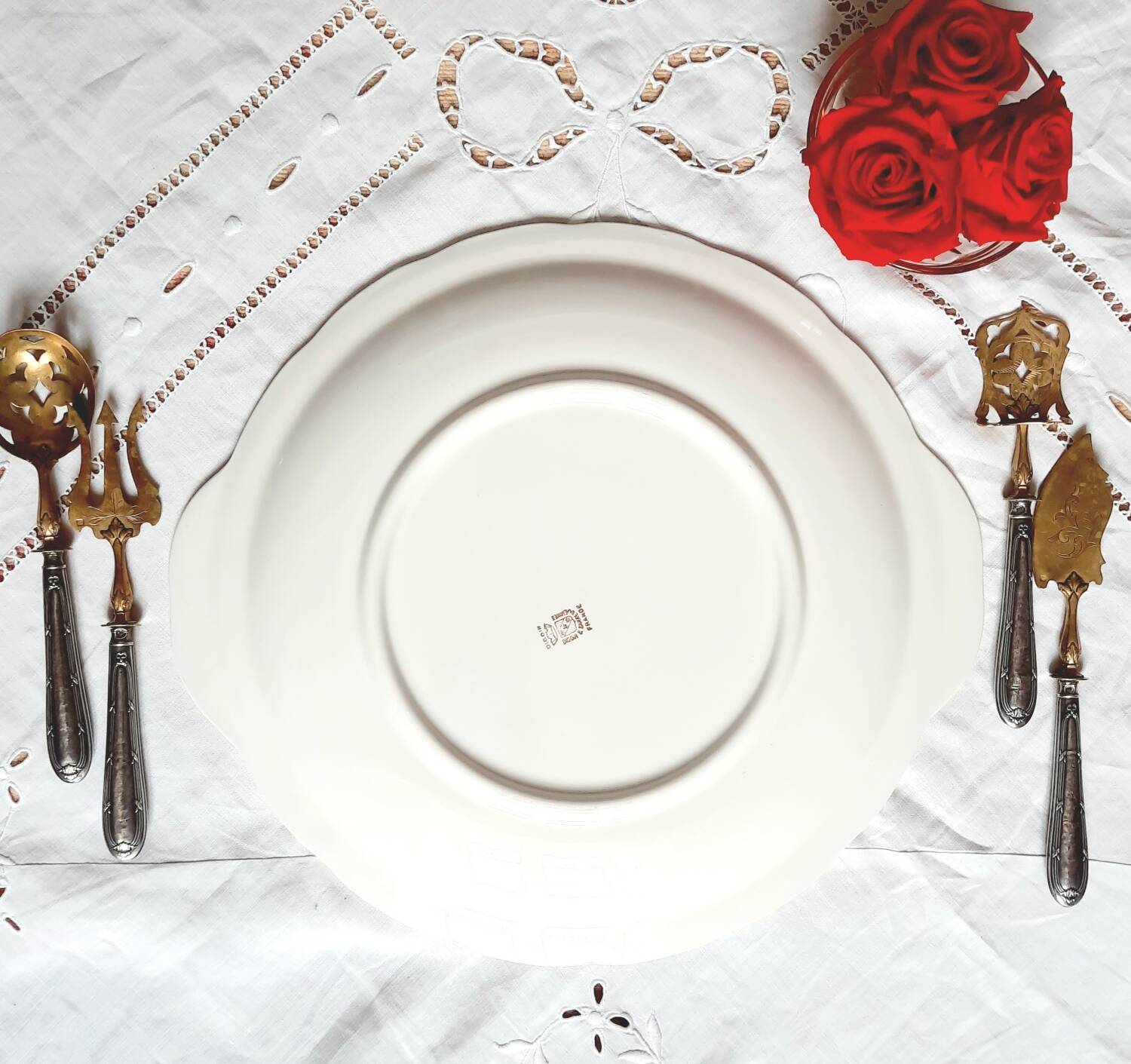 Old mismatched earthenware dessert plates with gold accompanied by a dish