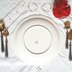 Old mismatched earthenware dessert plates with gold accompanied by a dish