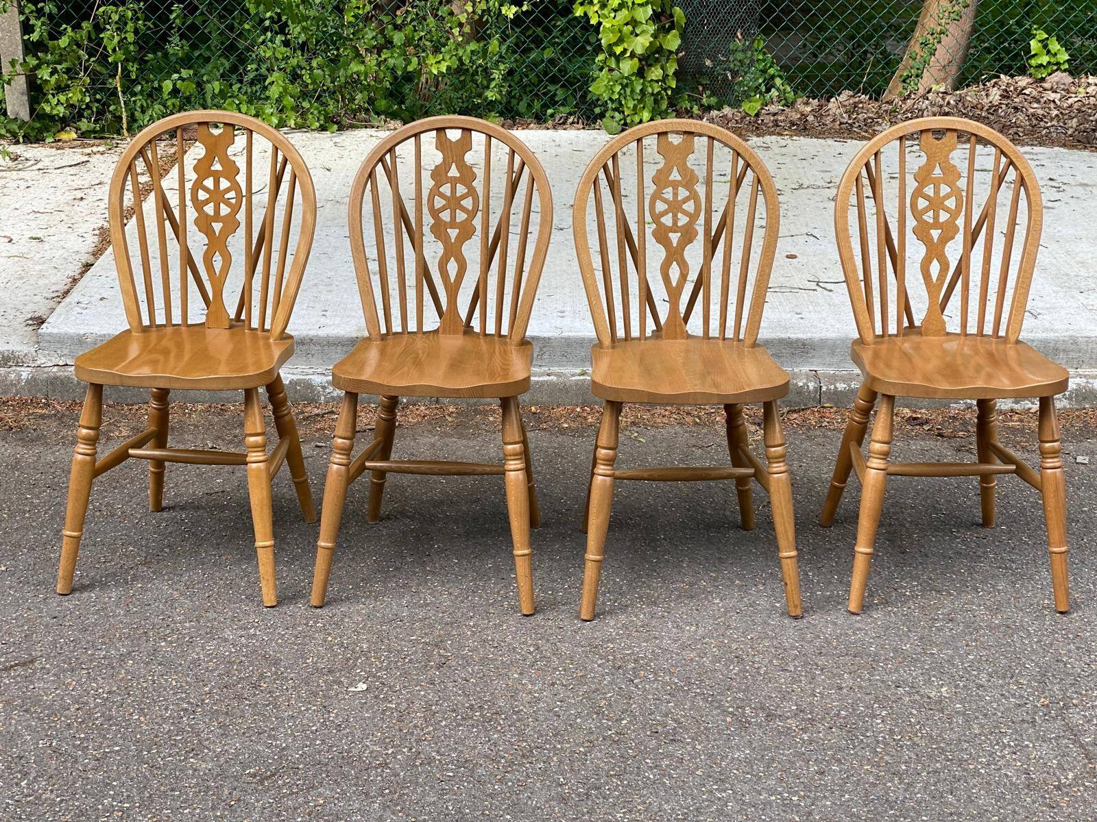 4 Windsor Wheelback English chairs in solid curved wood interior's
