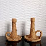 Pair of cork and terracotta candlesticks.