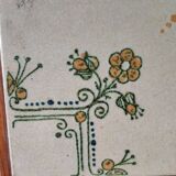 Vintage ceramic trivet – stylised floral design