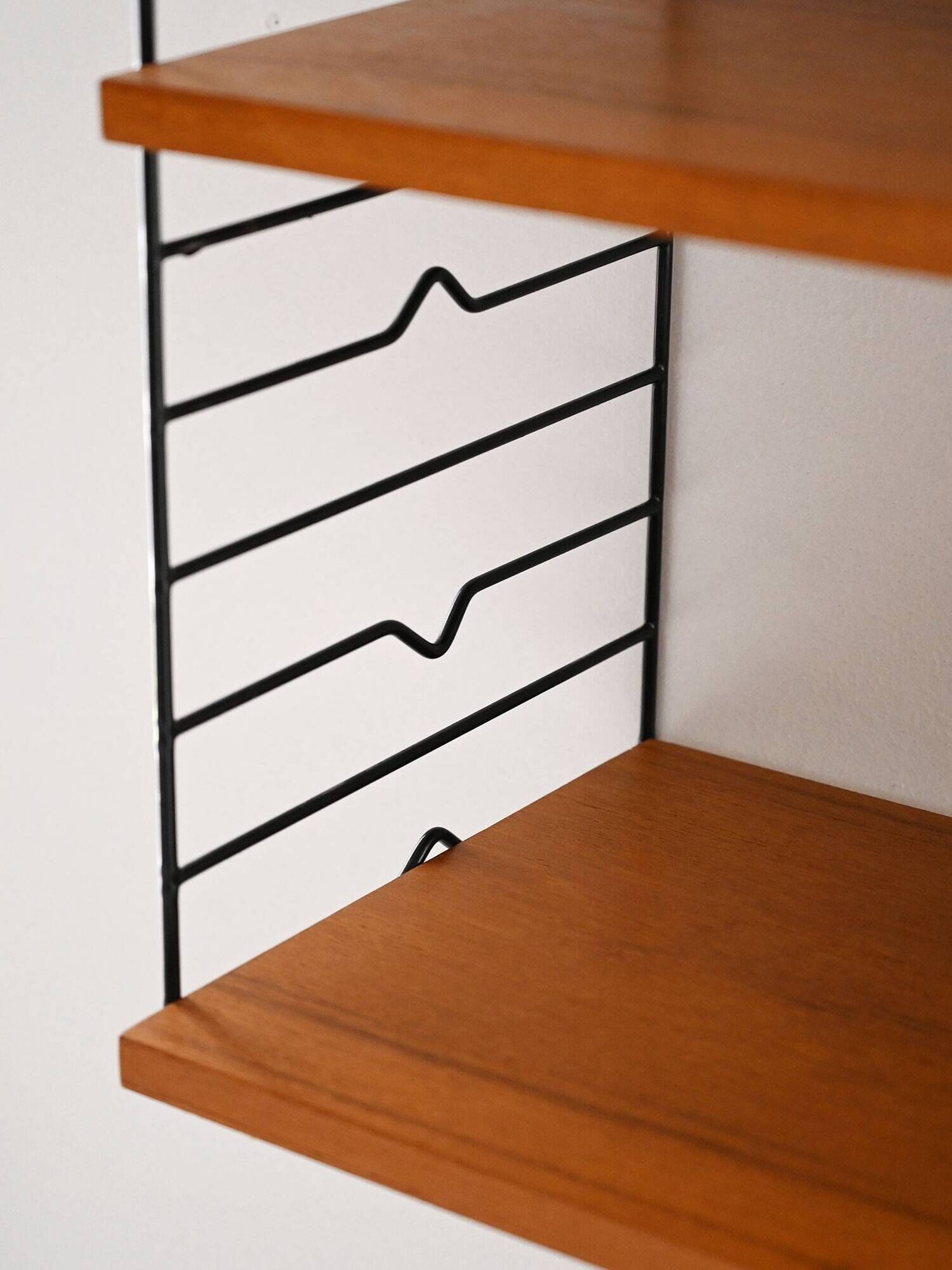 Scandinavian Hylla teak wall shelf with brass label