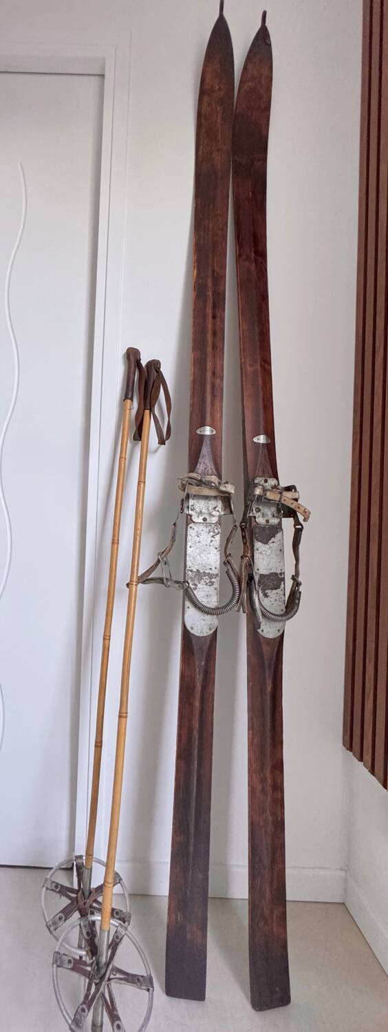 Antique wooden skis with vintage poles