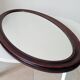 Oval antique mirror in solid wood from the 1960s.
