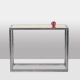 Maison Jansen. Console in brushed aluminium and verre églomisé top.