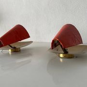 Pair of orange plexiglass and curved brass wall lights, 1950s, Germany