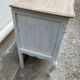 Adorable small chest of drawers or weathered white console.