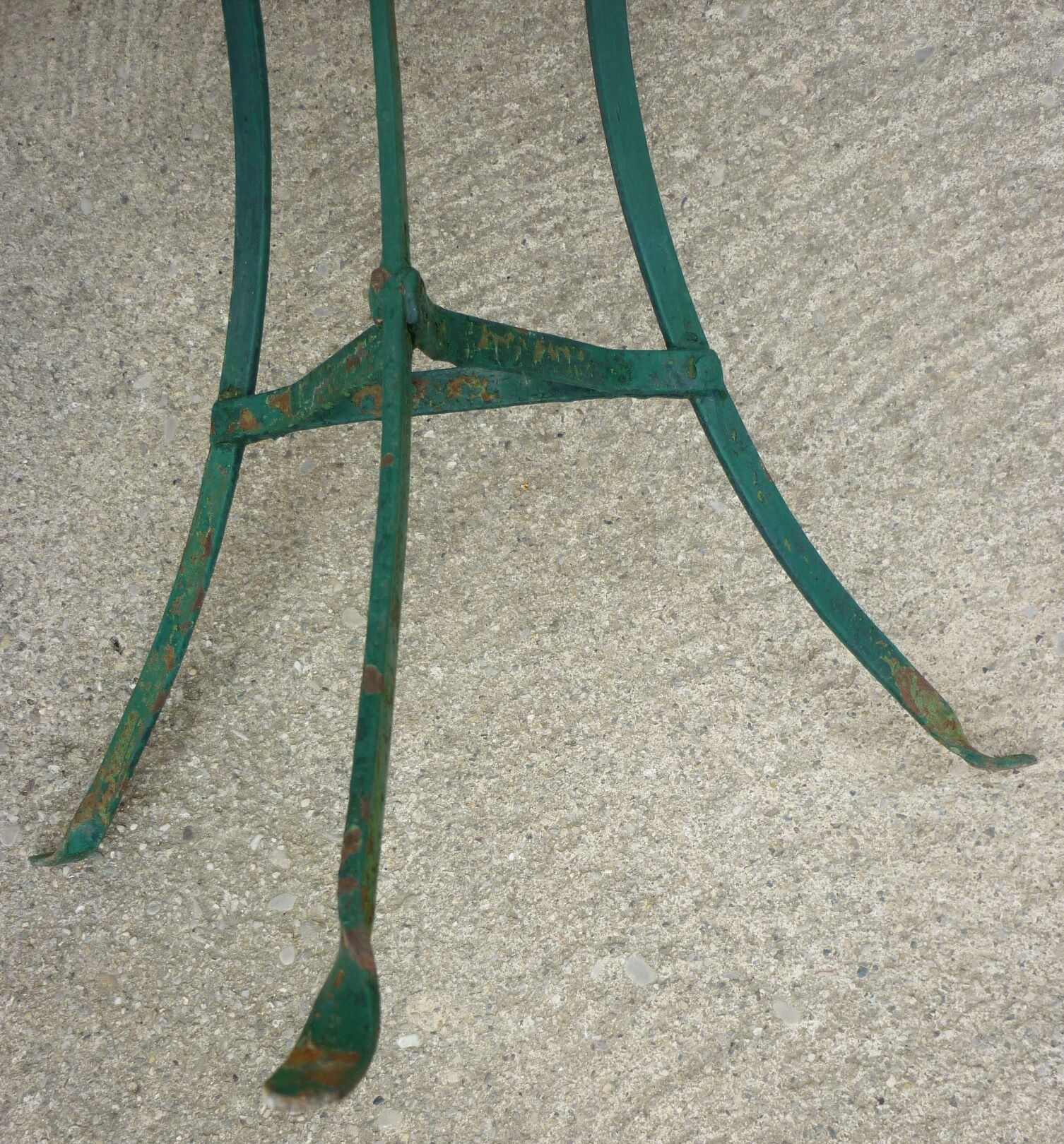 Old metal tripod garden pedestal