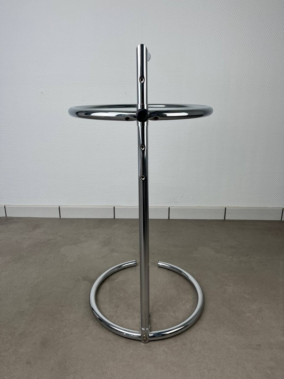 Chrome and glass design side table, adjustable.
