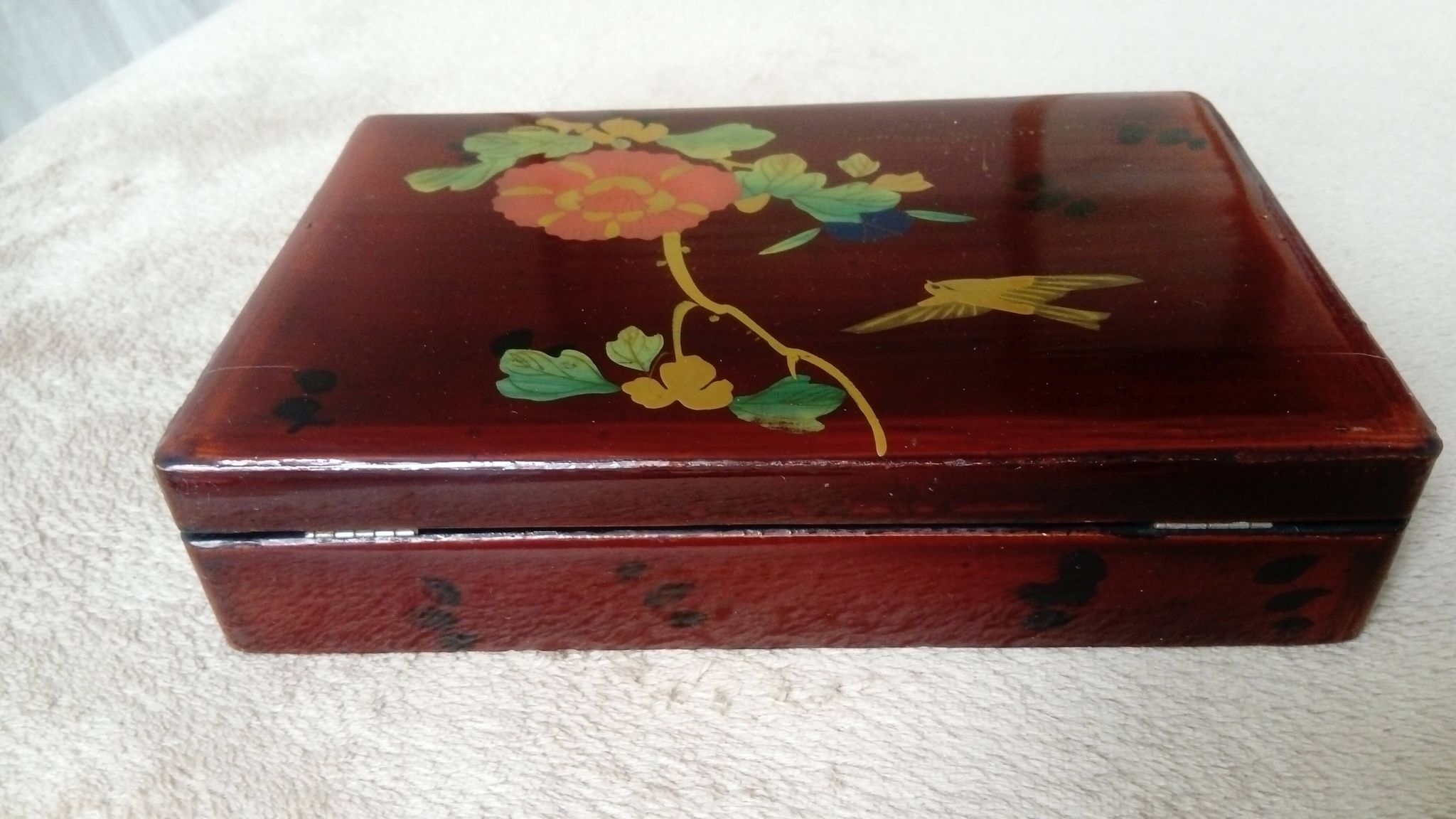 Old lacquered wooden box with china or japan decoration, bird and flower