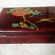 Old lacquered wooden box with china or japan decoration, bird and flower