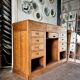 Counter, glass-fronted wooden workbench in dark wood, 8 drawers.