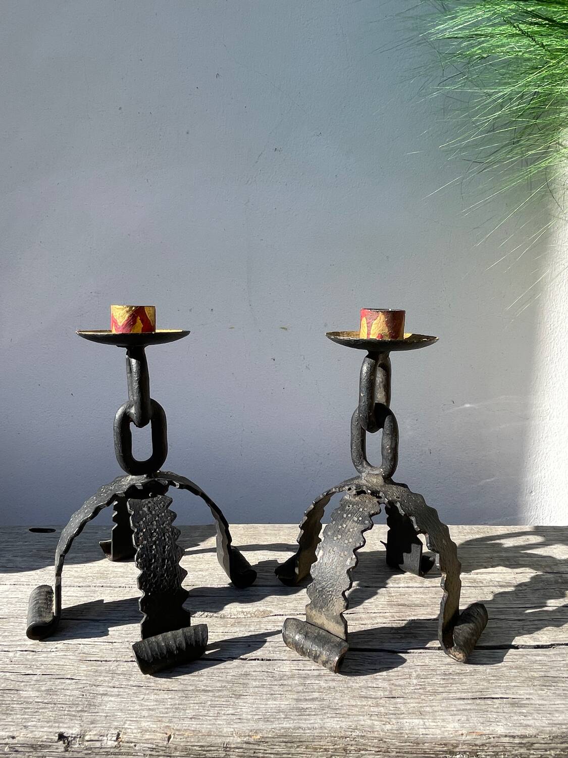 Pair of candlesticks with wrought iron chain