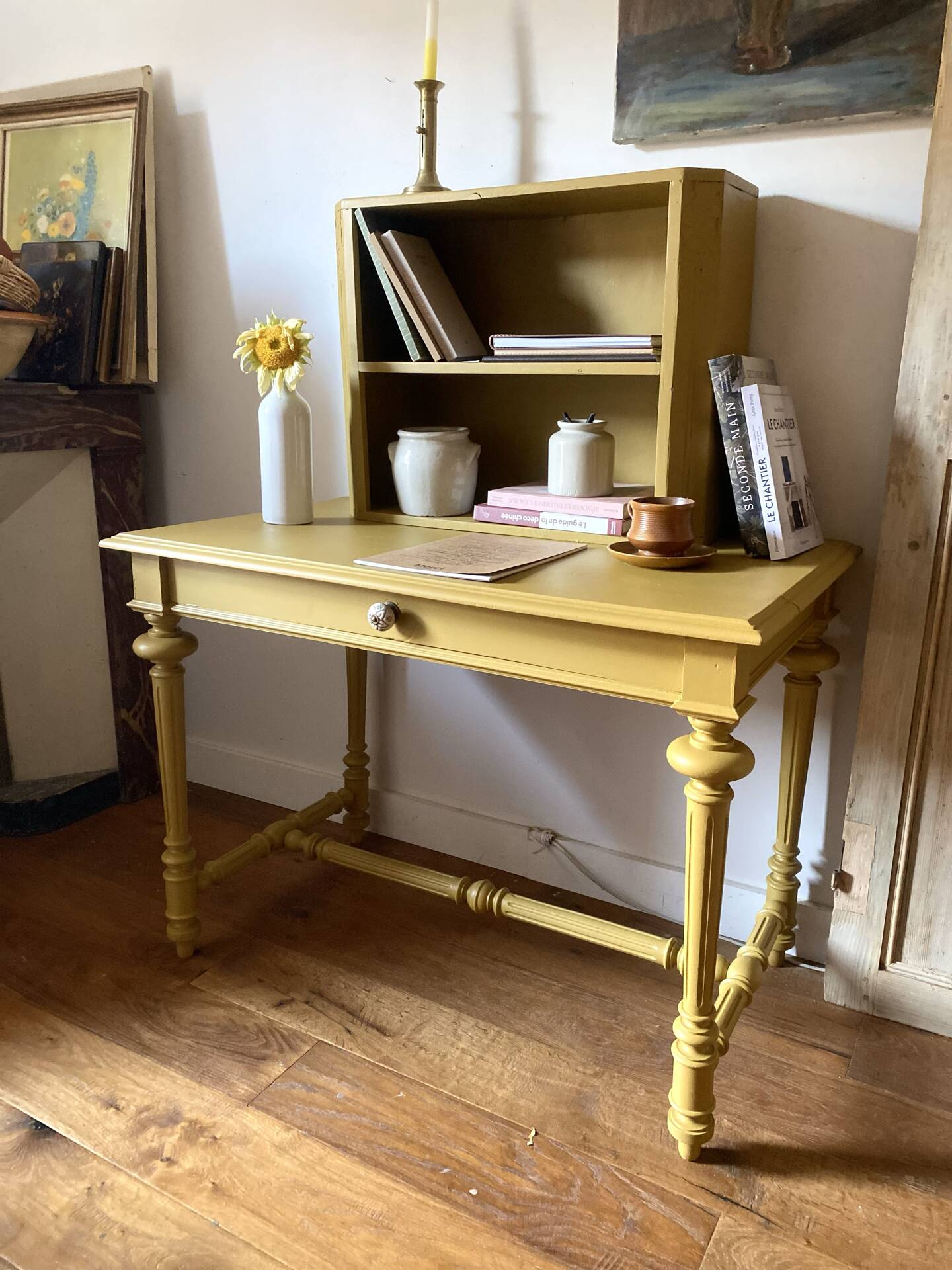 Desk table from the late 19th century, painted mustard, with turned stretcher.