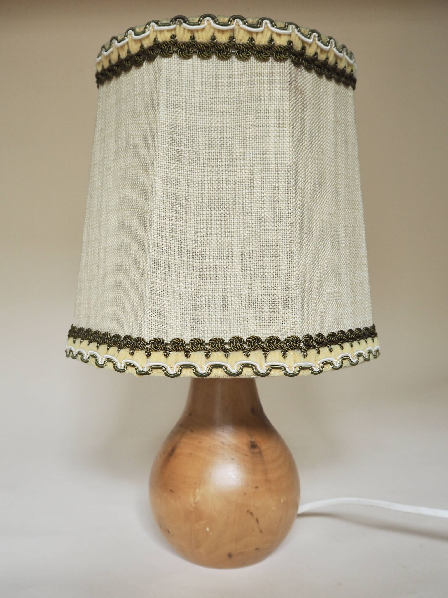 Turned wooden lamp with linen shade