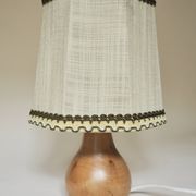 Turned wooden lamp with linen shade